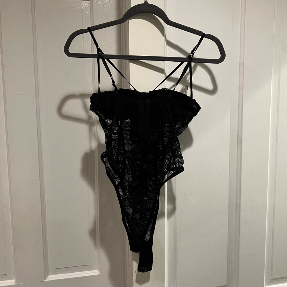 Black lacy body suit with straps